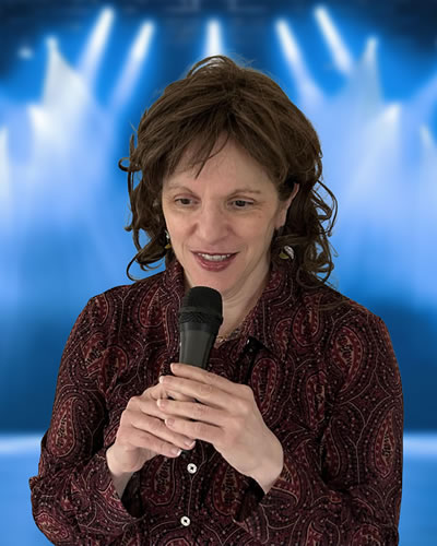Elena Yearly speaking on microphone